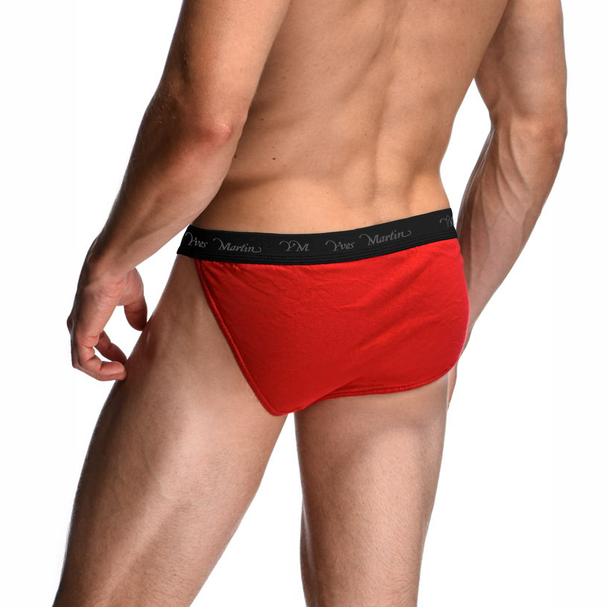 Male model wearing red Yves Martin tanga briefs, rear three-quarter view